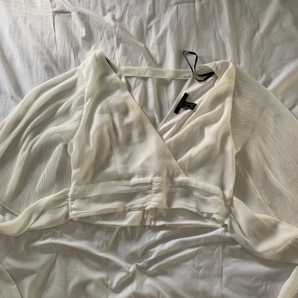 White crop top from Forever21 with flowing sleeves